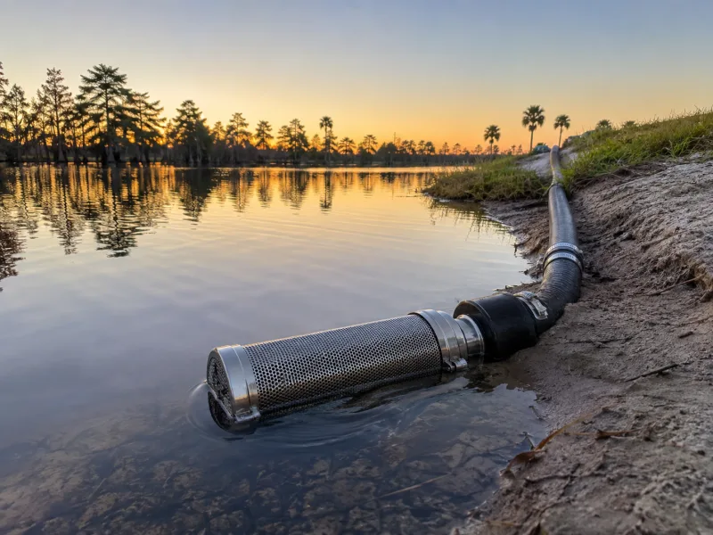 Lake-fed irrigation system with a screened intake set above the bottom silt on a Polk County lake